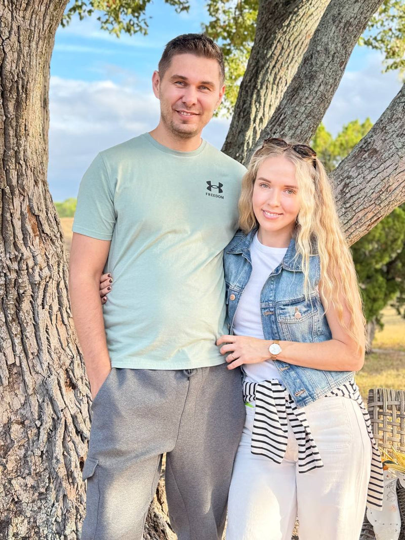 Andrii and Kateryna owners of WoodHarmonyUS custom wooden sign business in Tampa Florida workshop