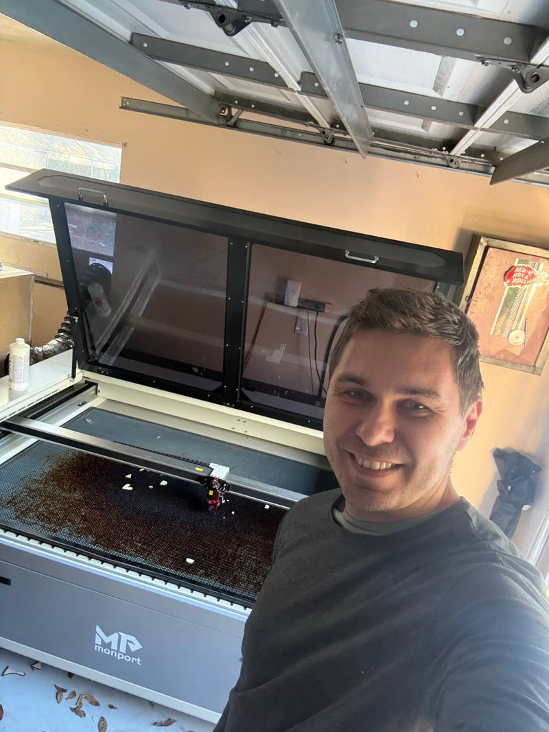 Hand-rubbing wood stain technique on Baltic Birch plywood demonstrating traditional finishing method for custom signs in Tampa workshop