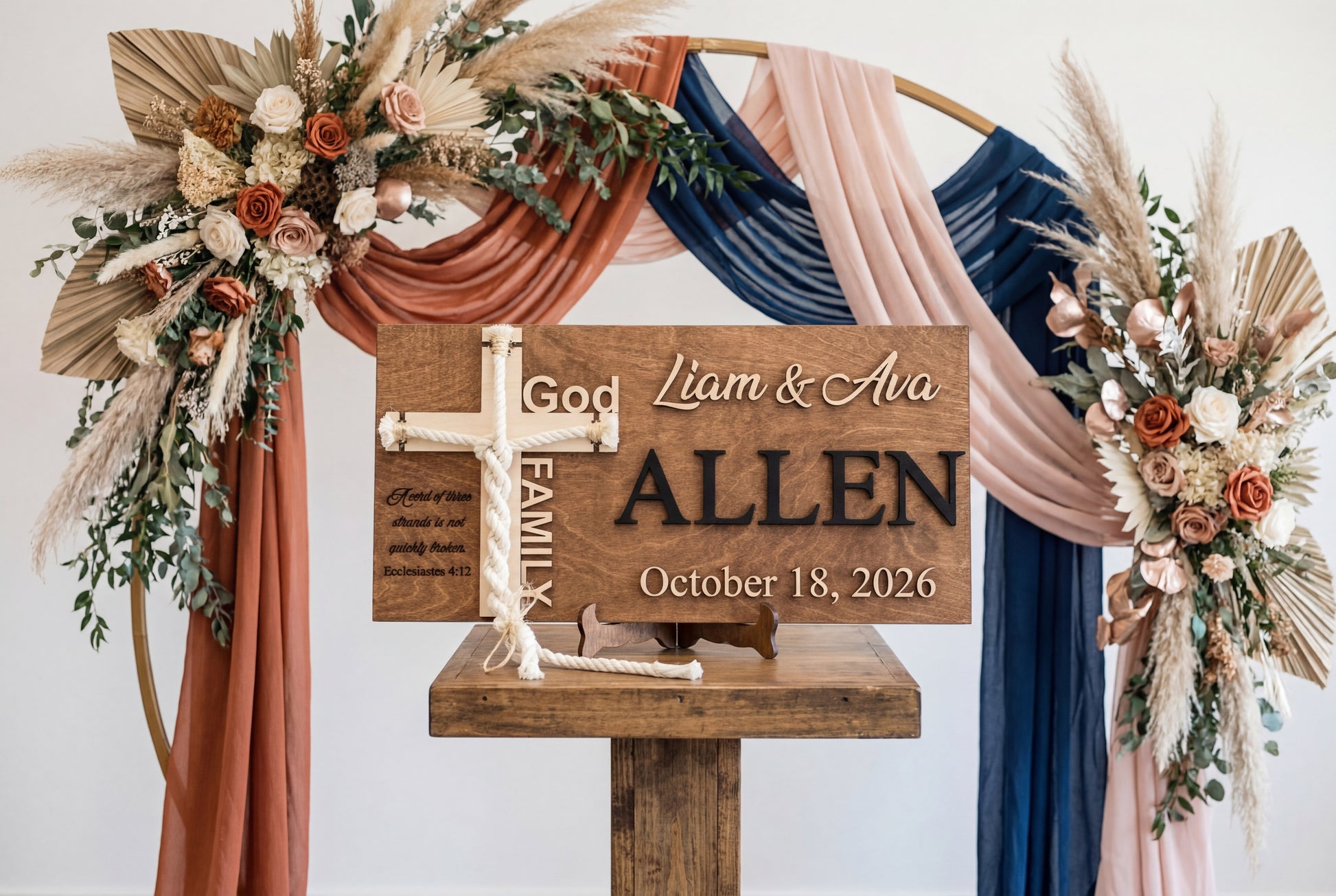 Allen family cord of three strands sign on a wooden stand at a floral ceremony arch