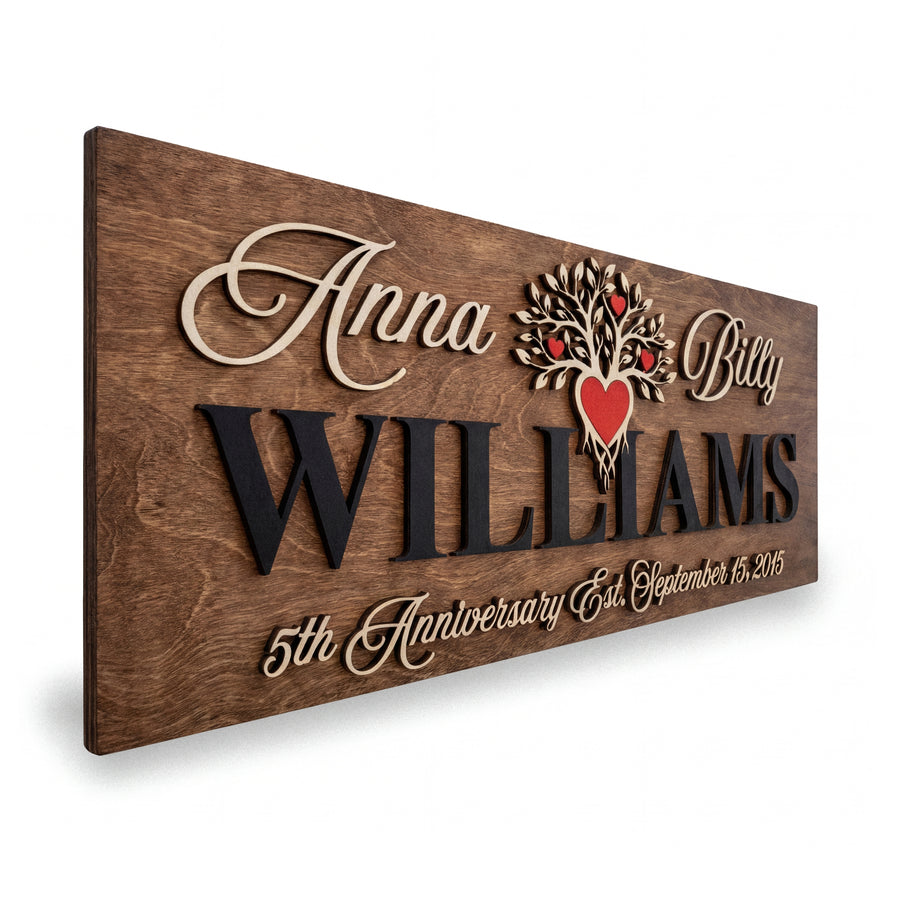 Walnut wood sign with a carved family tree and red hearts, reading Anna & Billy, WILLIAMS, 5th Anniversary.
