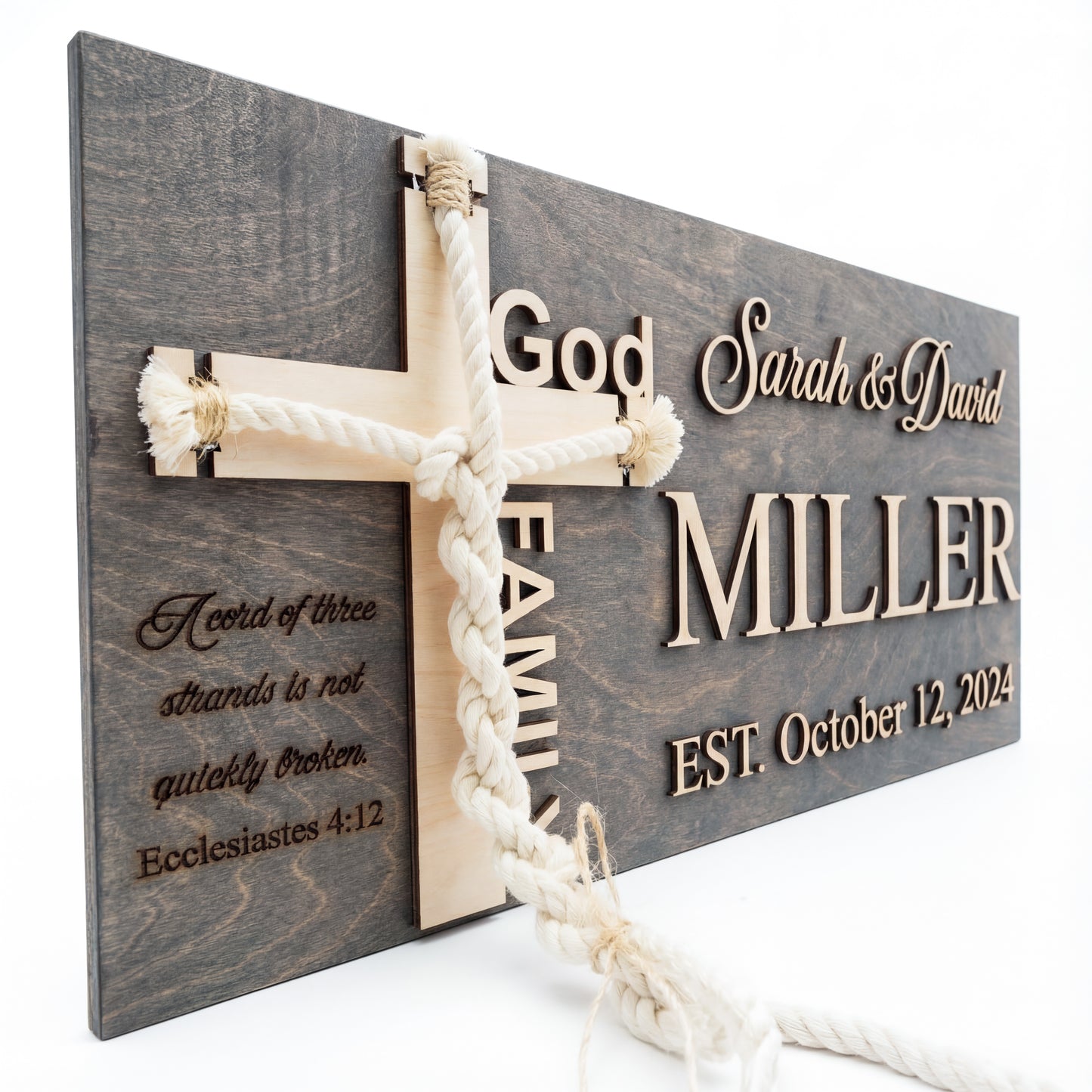 Close-up of a grey cord of three strands sign showing the braided cord and Miller family name